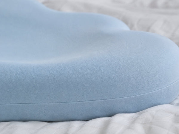Close-up of the blue pillow surface and seam