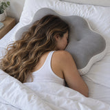 Shoulder resting in the notch between two lobes of the pillow